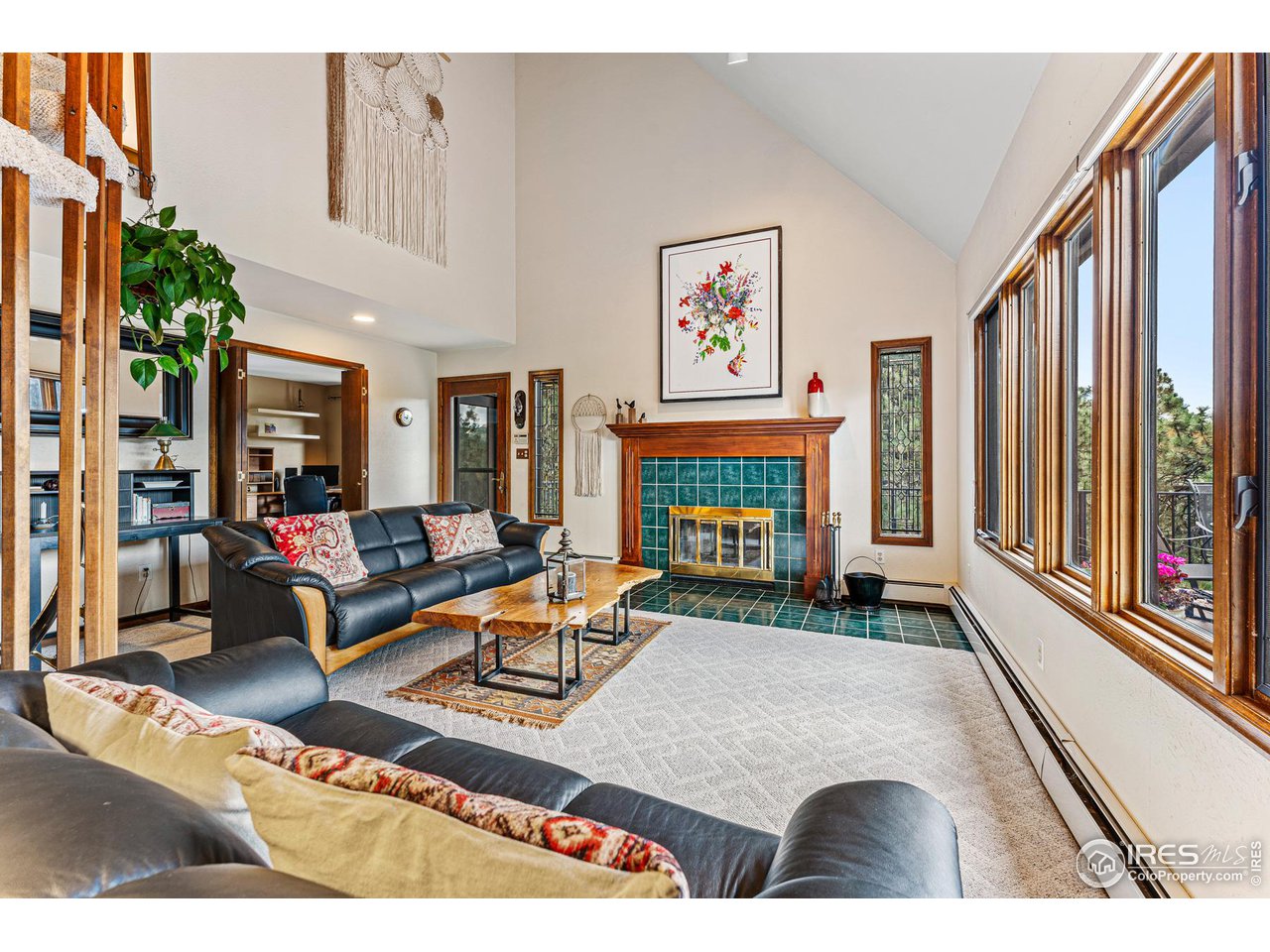 297 Broken Fence Road Boulder, CO 80302 - Photo 17 of 39 Vaulted and airy living room with south windows/views