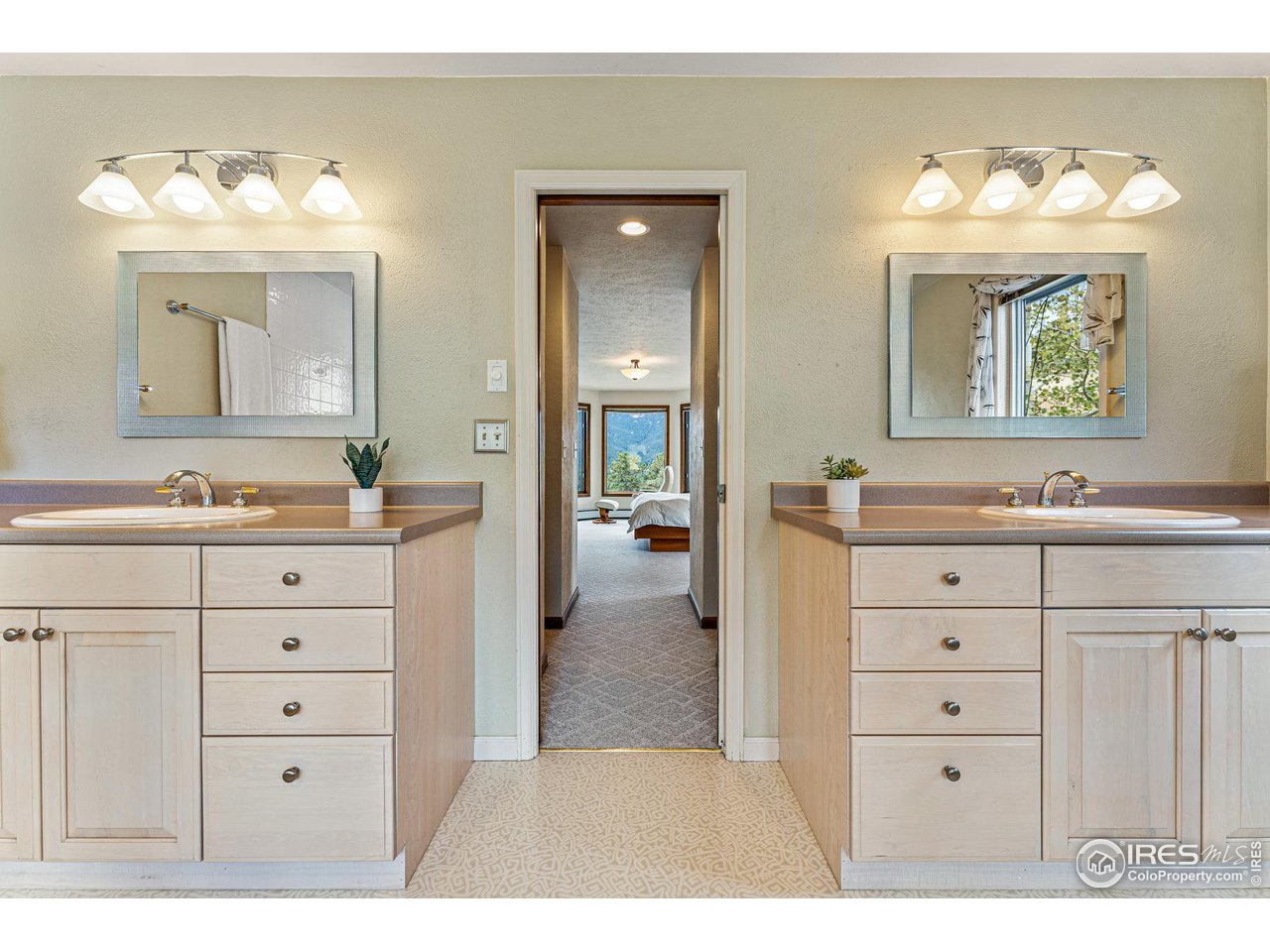 297 Broken Fence Road Boulder, CO 80302 - Photo 25 of 39 Primary bathroom with double vanities