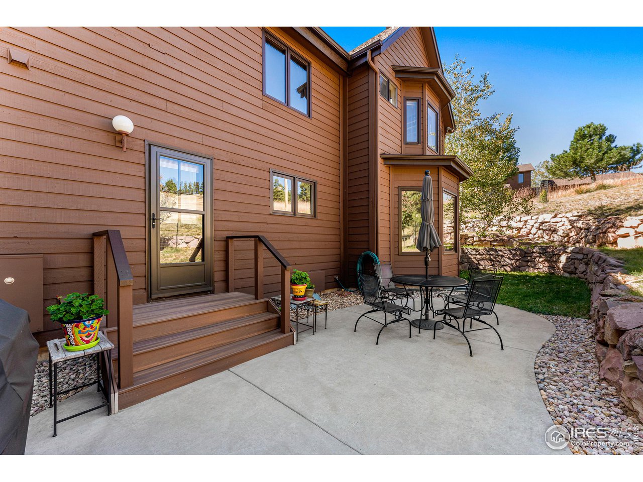 297 Broken Fence Road Boulder, CO 80302 - Photo 32 of 39 Rear concrete patio and grill area