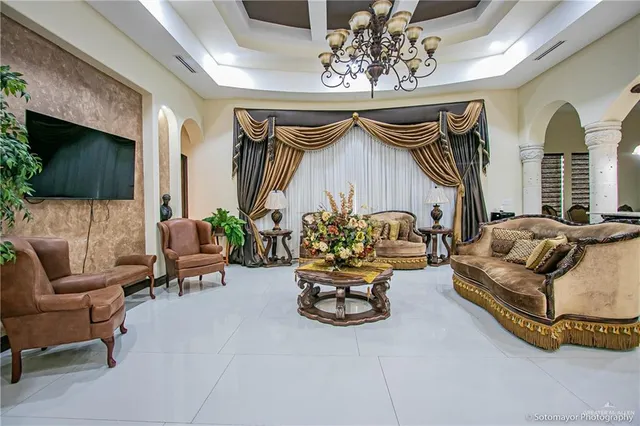a living room with furniture and a flat screen tv