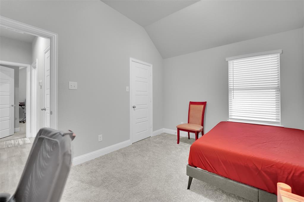 1340 Collett Sublett Road Kennedale, TX 76060 - Photo 22 of 25 Room with light gray walls, vaulted ceiling, and gray carpet flooring