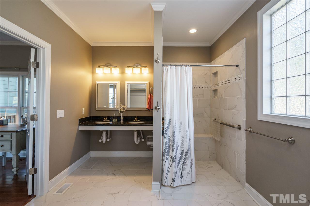 904 Windrow Lane Raleigh, NC 27603 - Photo 11 of 25 Accessibility features include hand bars, lowered sinks, wheel-in shower, open access closet.
