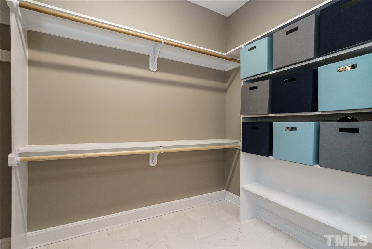 904 Windrow Lane Raleigh, NC 27603 - Photo 12 of 25 Closet offers easy-reach shelves and hanging rods.