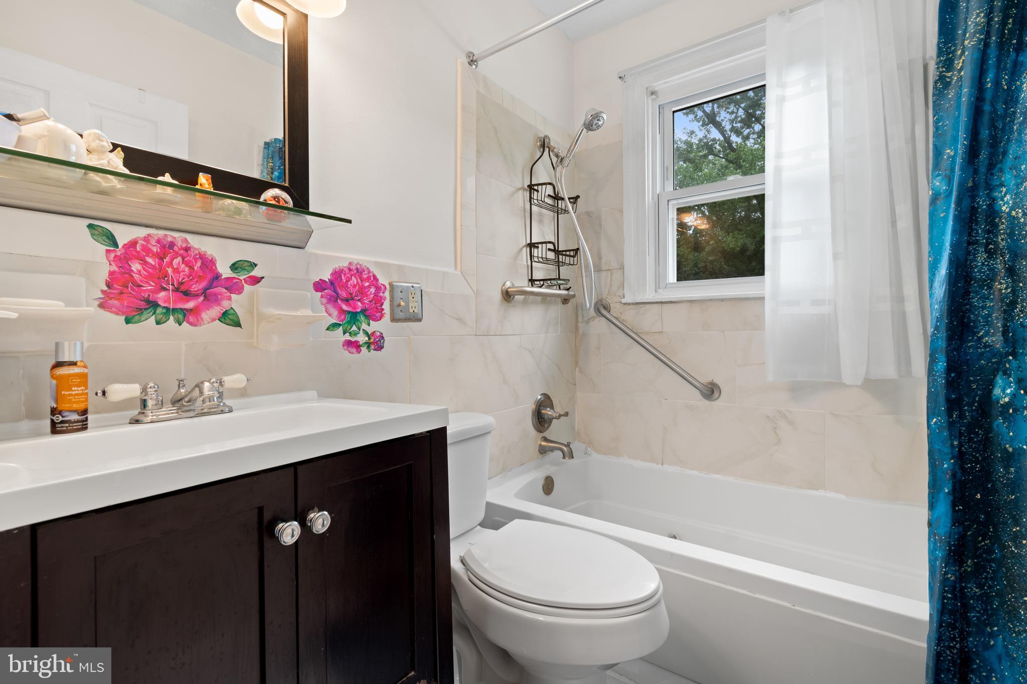 4410 Allies Road Suitland, MD 20746 - Photo 16 of 30 a bathroom with a sink vanity mirror bathtub and toilet