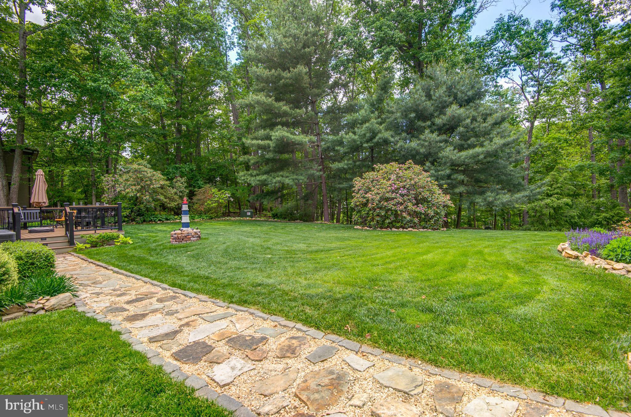 10116 Evans Ford Road Manassas, VA 20111 - Photo 45 of 63 a view of a garden with a tree