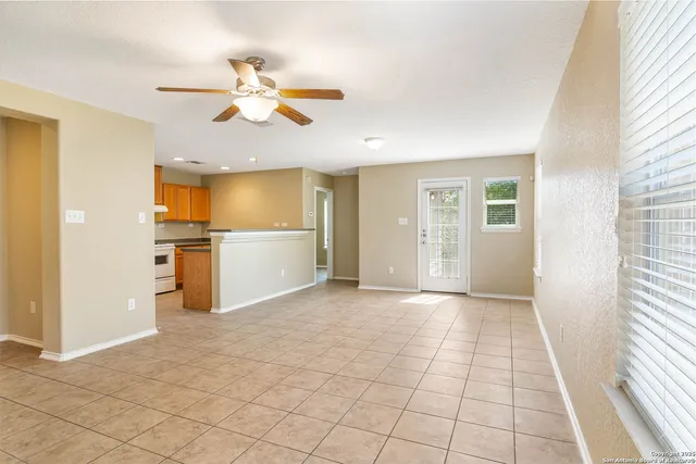 a view of a kitchen with a sink and a window