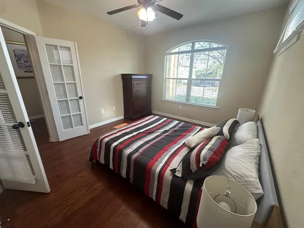 a bedroom with a bed and a window