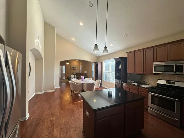 a view of hallway with wooden floor