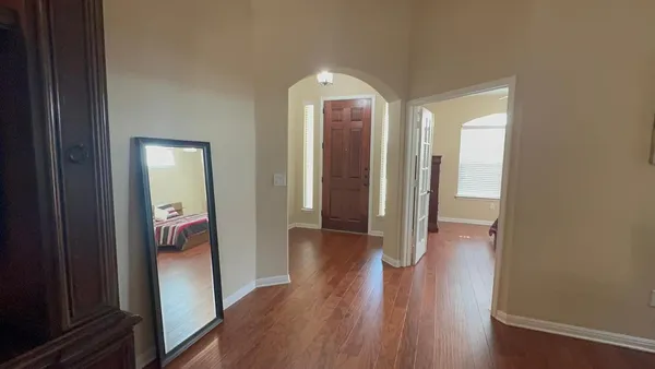 a bedroom with a bed and a dresser