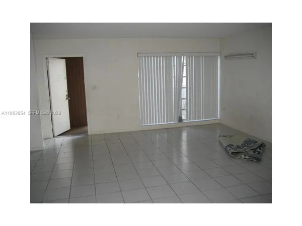 a black and white photo of a living room