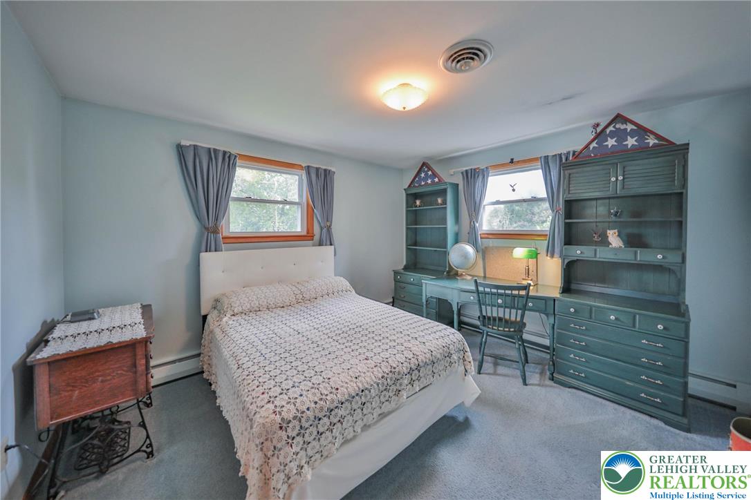 141 East Berger Street Emmaus, PA 18049 - Photo 21 of 49 a bedroom with a bed and a dresser in it