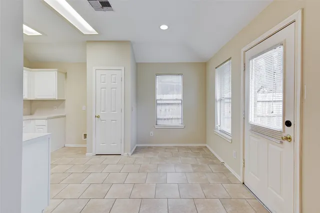a view of an empty room with a window