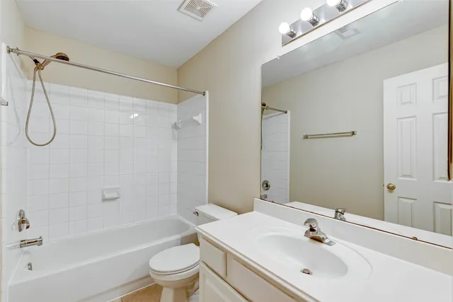 a bathroom with a sink a toilet and a bathtub