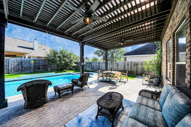 a outdoor space with patio lots of furniture and garden view