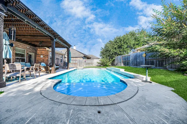 a view of a backyard with a fountain