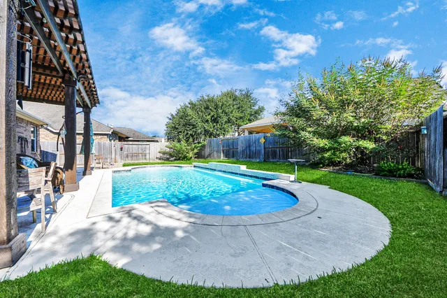 a view of a backyard with a garden