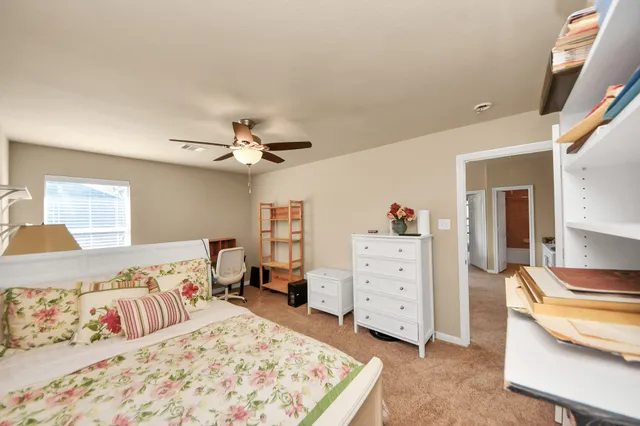 a bed room with a bed and a chandelier