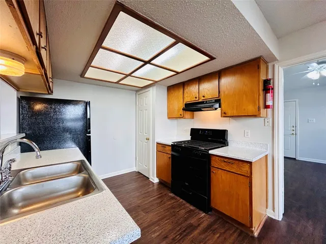 a kitchen with a stove and a microwave