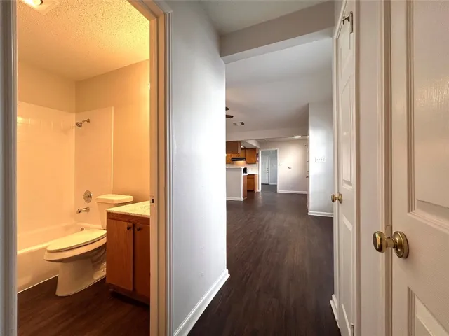 a view of bathroom with a toilet sink and a mirror