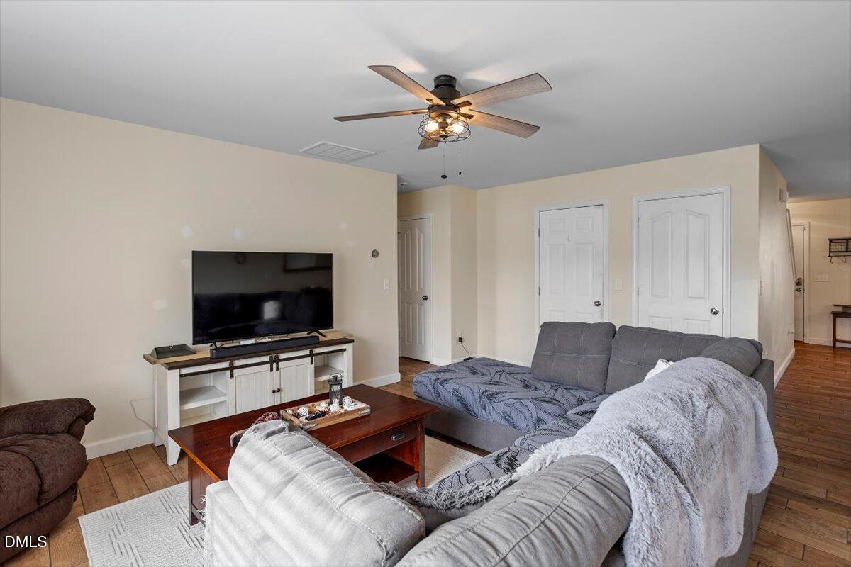 205 Battery Way Bunnlevel, NC 28323 - Photo 11 of 37 a living room with furniture and a flat screen tv