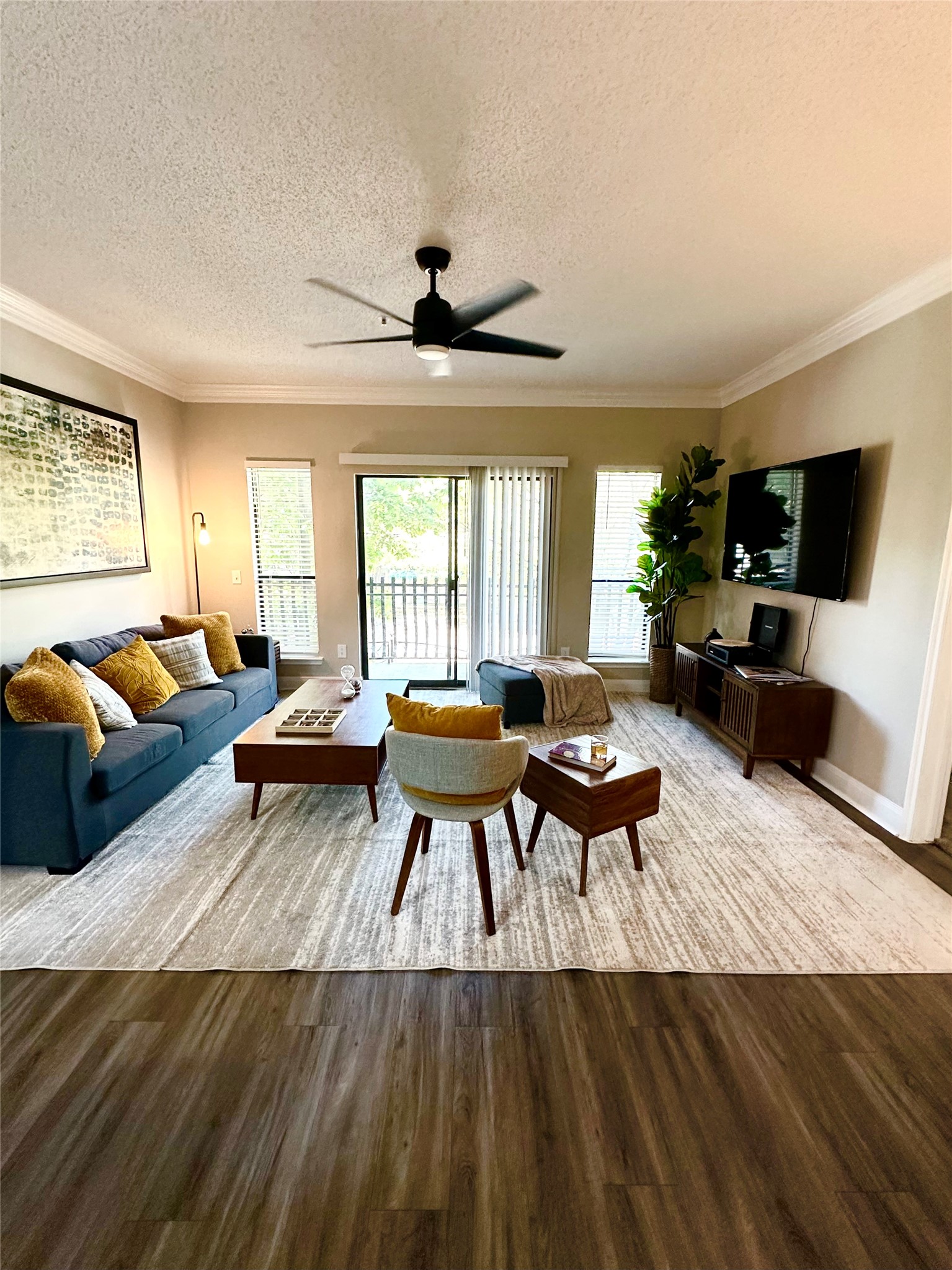 2345 Sage Road, Unit 143 Houston, TX 77056 - Photo 10 of 19 a living room with furniture and a flat screen tv