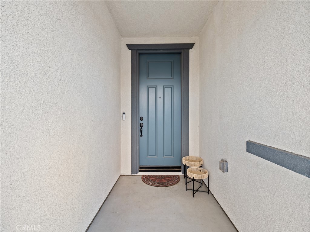 11520 Ferro Street Victorville, CA 92392 - Photo 2 of 40 a room that has a chair and a window