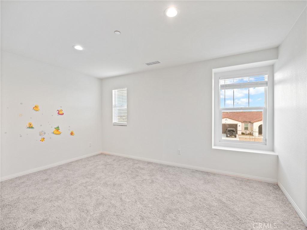 11520 Ferro Street Victorville, CA 92392 - Photo 29 of 40 an empty room with a window