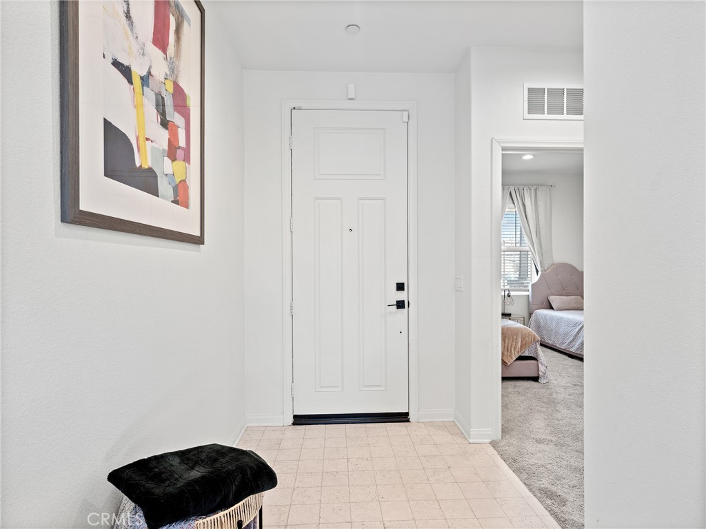 11520 Ferro Street Victorville, CA 92392 - Photo 3 of 40 a bedroom with a bed and a view of bathroom