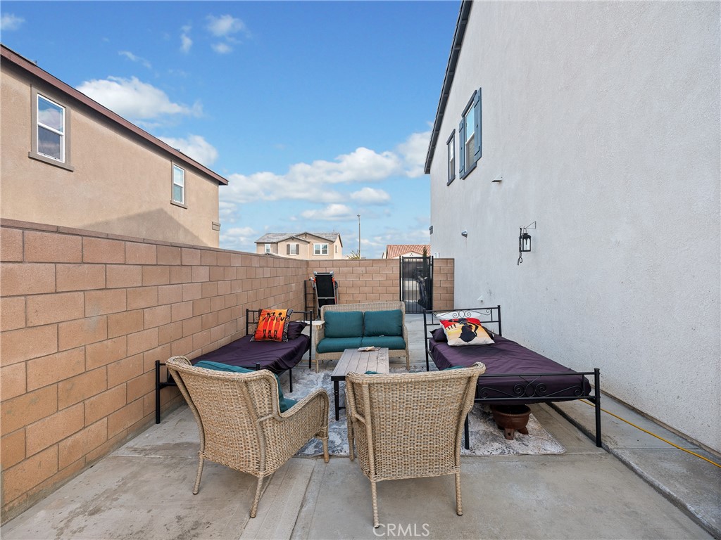 11520 Ferro Street Victorville, CA 92392 - Photo 35 of 40 a outdoor sitting area with furniture and wooden floor