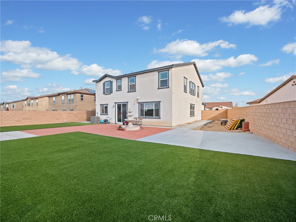 11520 Ferro Street Victorville, CA 92392 - Photo 36 of 40 a front view of a house with garden