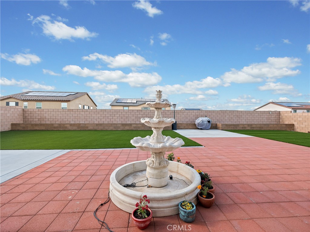 11520 Ferro Street Victorville, CA 92392 - Photo 37 of 40 a patio with a yard and lake view