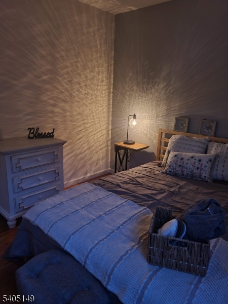 944 Flora Street Elizabeth, NJ 07201 - Photo 18 of 19 a bedroom with a bed and a dresser