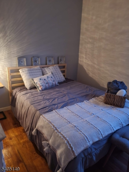 944 Flora Street Elizabeth, NJ 07201 - Photo 19 of 19 a bedroom with a bed and with the couch