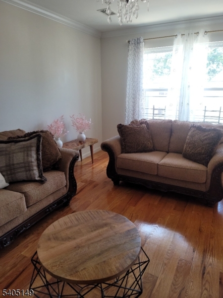 944 Flora Street Elizabeth, NJ 07201 - Photo 2 of 19 a living room with furniture and a window
