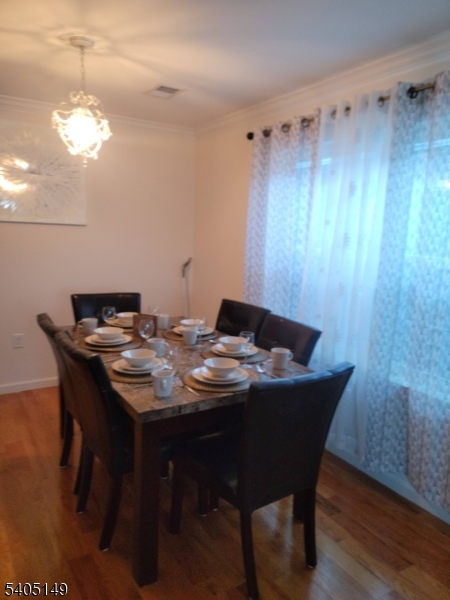 944 Flora Street Elizabeth, NJ 07201 - Photo 7 of 19 a view of a dining room with furniture and wooden floor