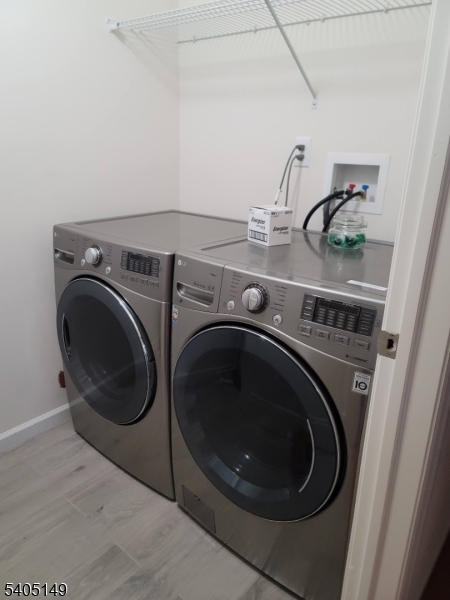 944 Flora Street Elizabeth, NJ 07201 - Photo 8 of 19 a utility room with dryer and washer