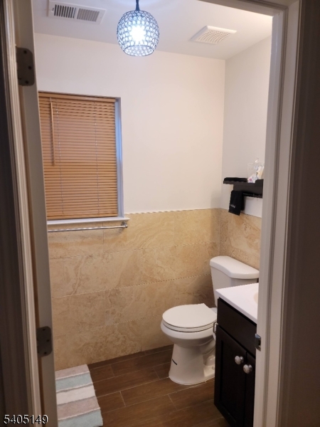 944 Flora Street Elizabeth, NJ 07201 - Photo 9 of 19 a white toilet sitting next to a bathroom sink