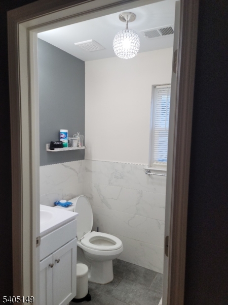 944 Flora Street Elizabeth, NJ 07201 - Photo 10 of 19 a bathroom with a toilet a sink and view