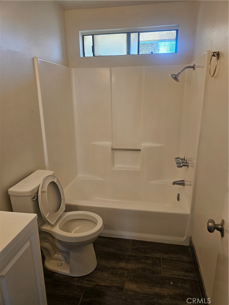 45419 10th Street West, Unit B Lancaster, CA 93534 - Photo 17 of 18 a bathroom with a toilet and a shower