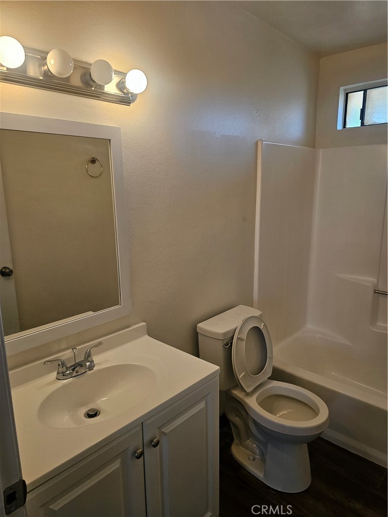 45419 10th Street West, Unit B Lancaster, CA 93534 - Photo 18 of 18 a bathroom with a sink toilet and shower