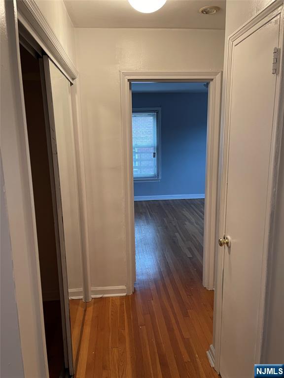 245 Passaic Avenue, Unit B4 Passaic, NJ 07055 - Photo 8 of 13 a view of a hallway with wooden floor