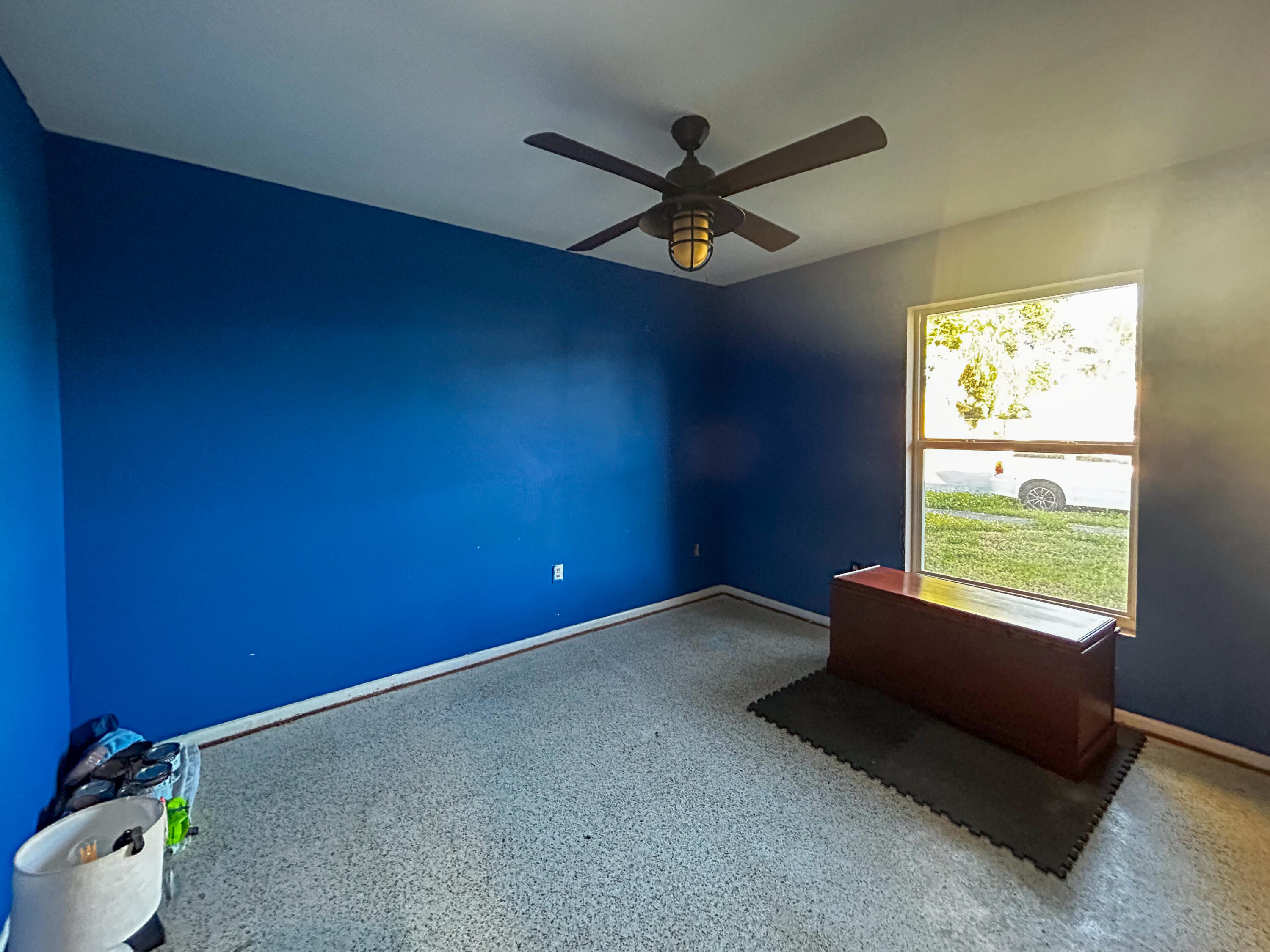868 Lance Street Sebastian, FL 32958 - Photo 13 of 37 an empty room with a window and a fan