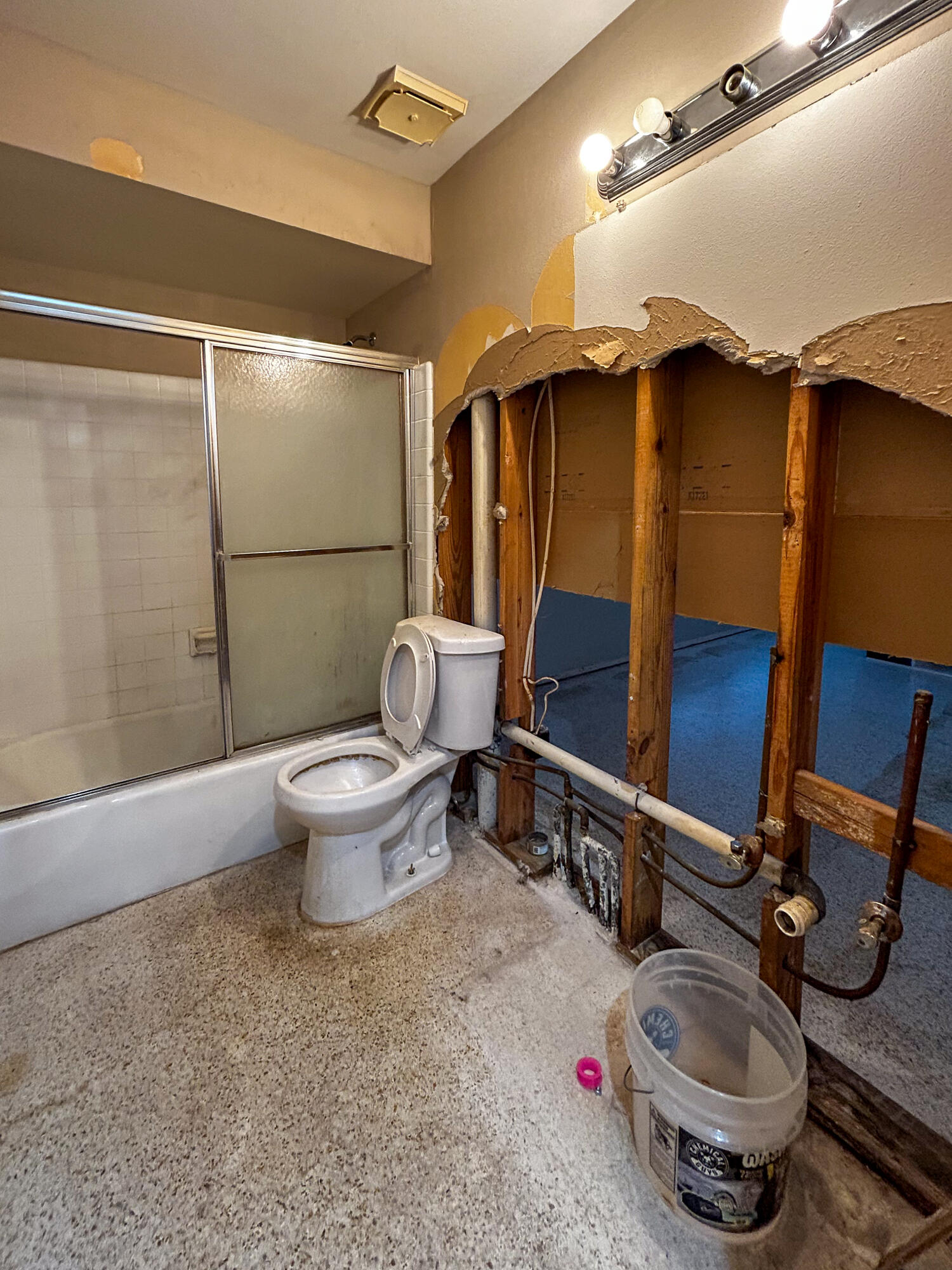 868 Lance Street Sebastian, FL 32958 - Photo 16 of 37 a bathroom with a toilet a sink and a mirror