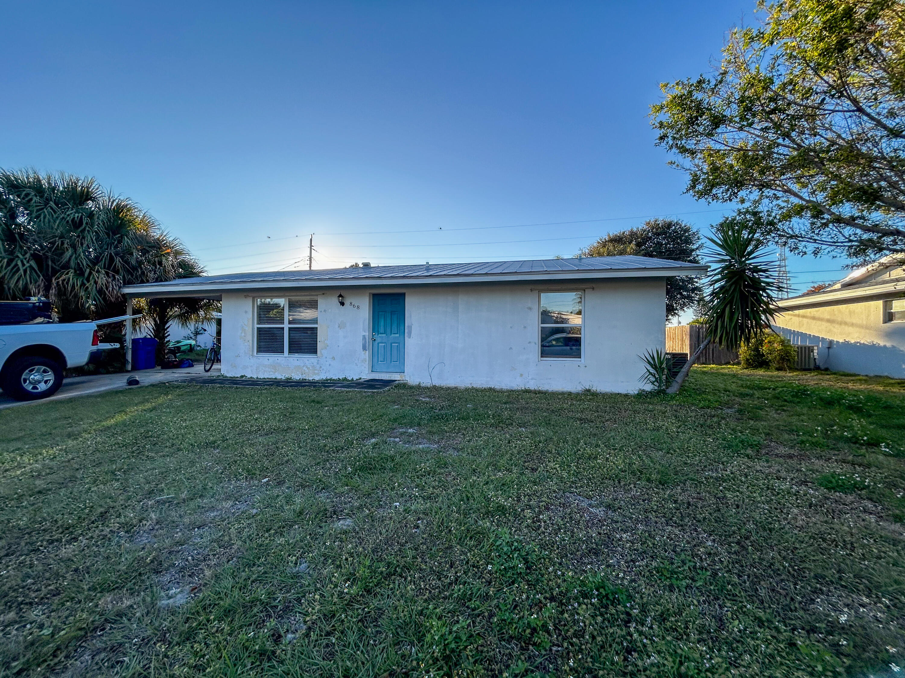 868 Lance Street Sebastian, FL 32958 - Photo 2 of 37 a front view of house with yard and outdoor seating