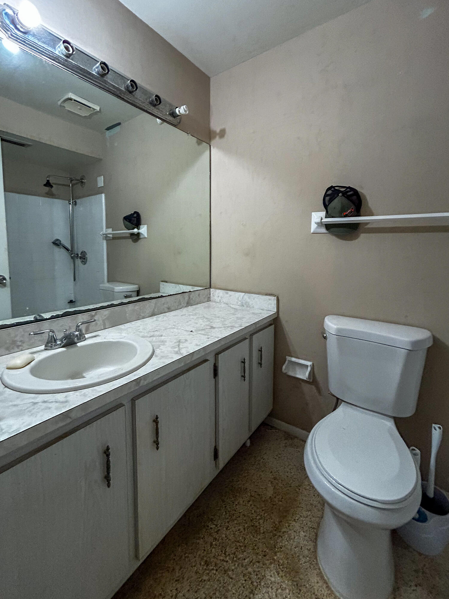 868 Lance Street Sebastian, FL 32958 - Photo 24 of 37 a bathroom with a toilet sink and mirror