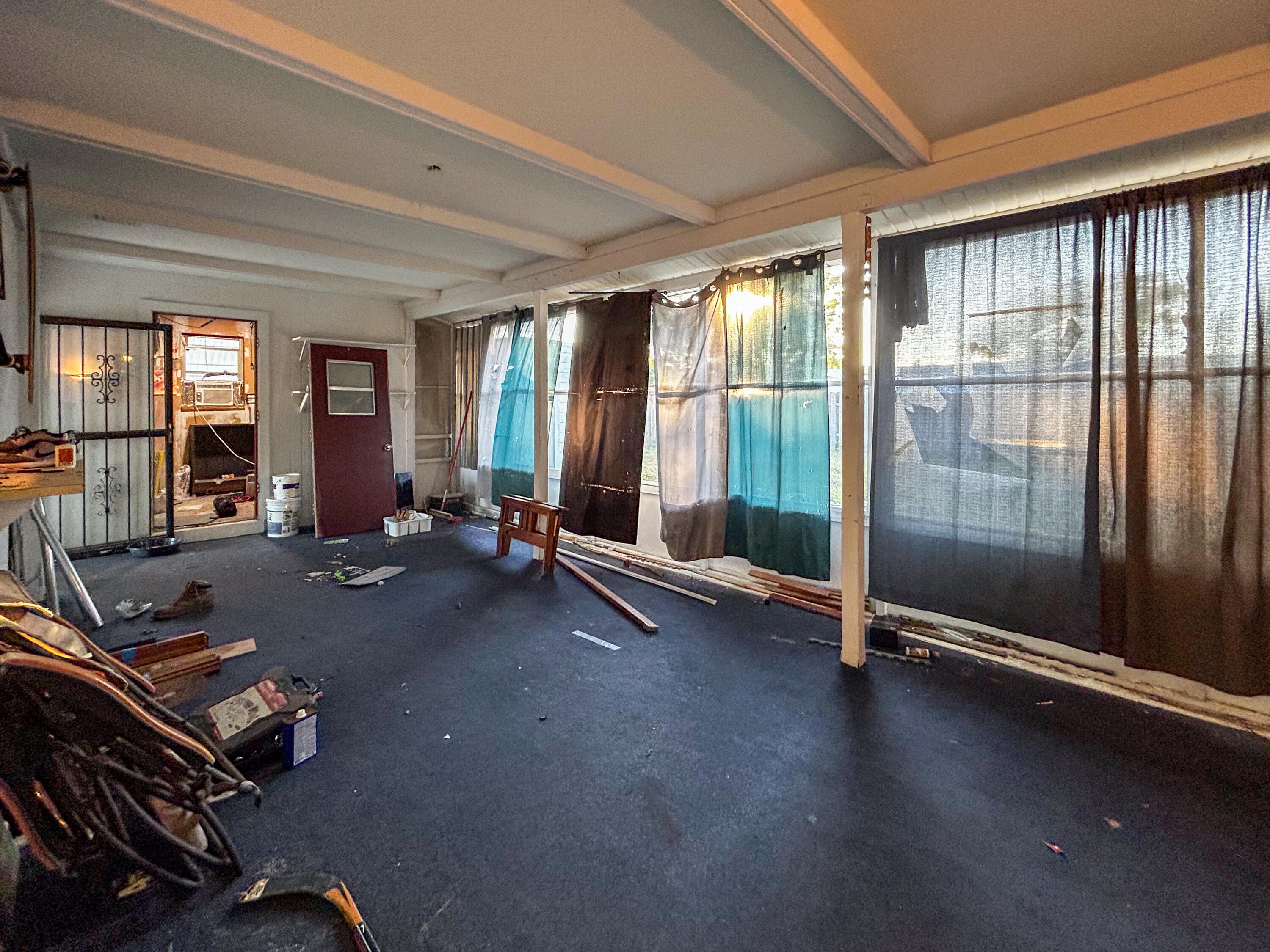 868 Lance Street Sebastian, FL 32958 - Photo 27 of 37 a room with gym equipment and a large window