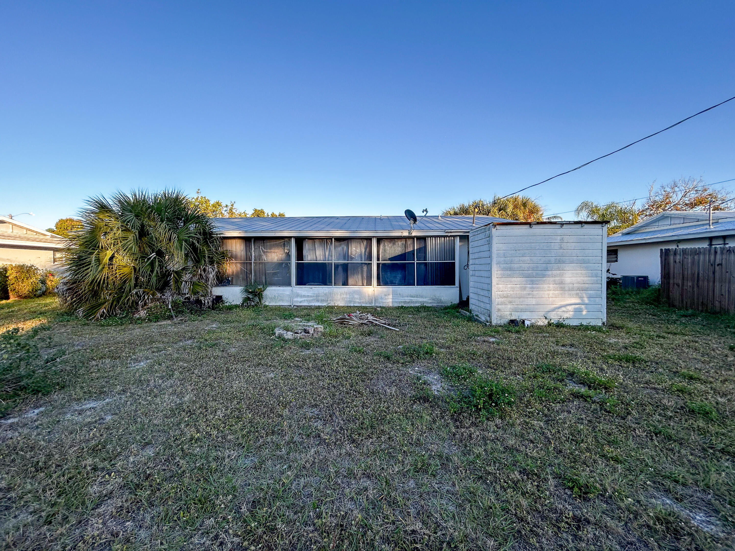868 Lance Street Sebastian, FL 32958 - Photo 35 of 37 a view of a house with backyard and a garden