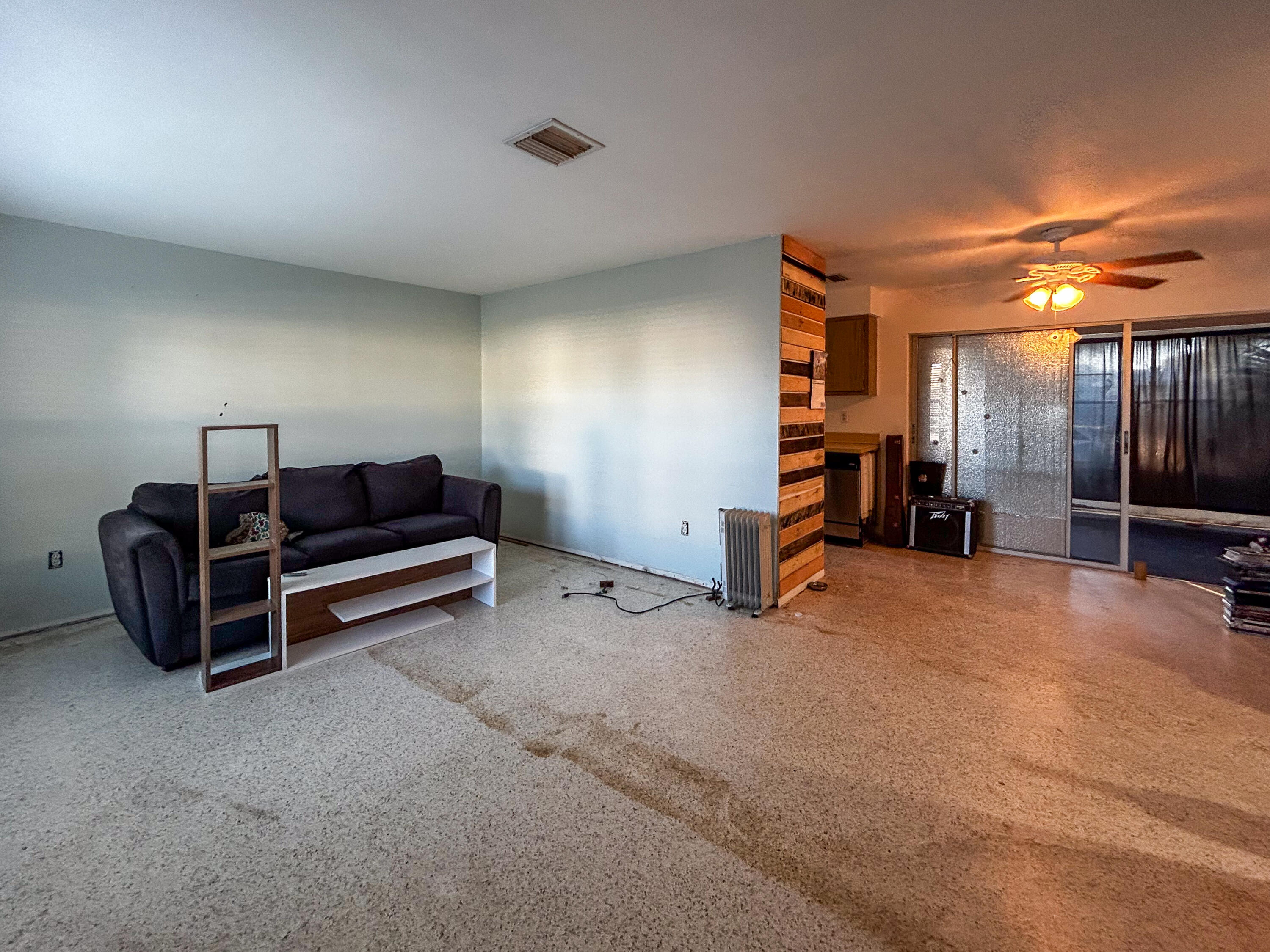 868 Lance Street Sebastian, FL 32958 - Photo 4 of 37 a view of a livingroom with furniture and a ceiling fan