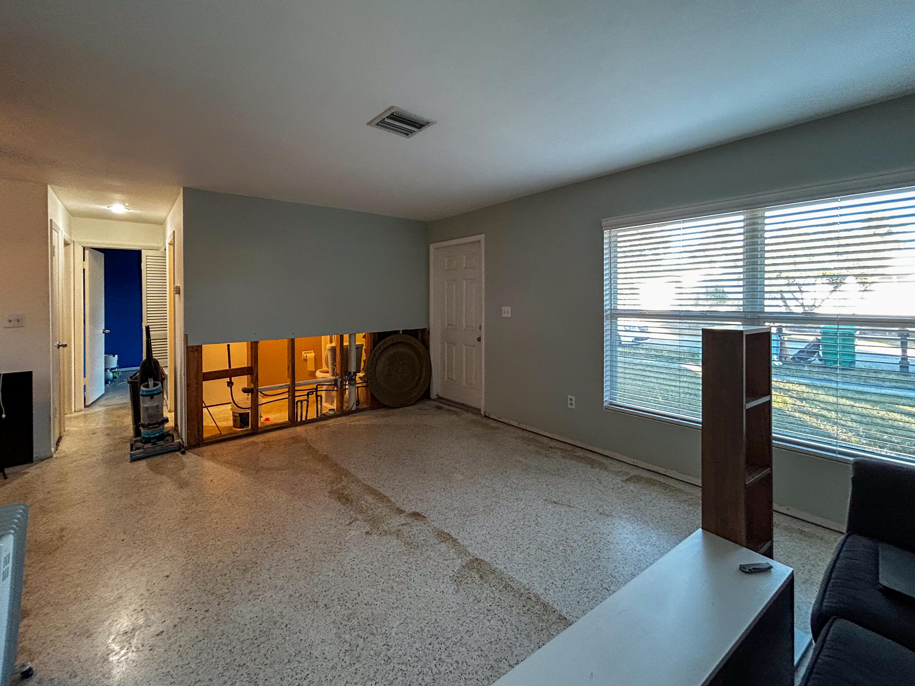 868 Lance Street Sebastian, FL 32958 - Photo 5 of 37 a view of an empty room with a window