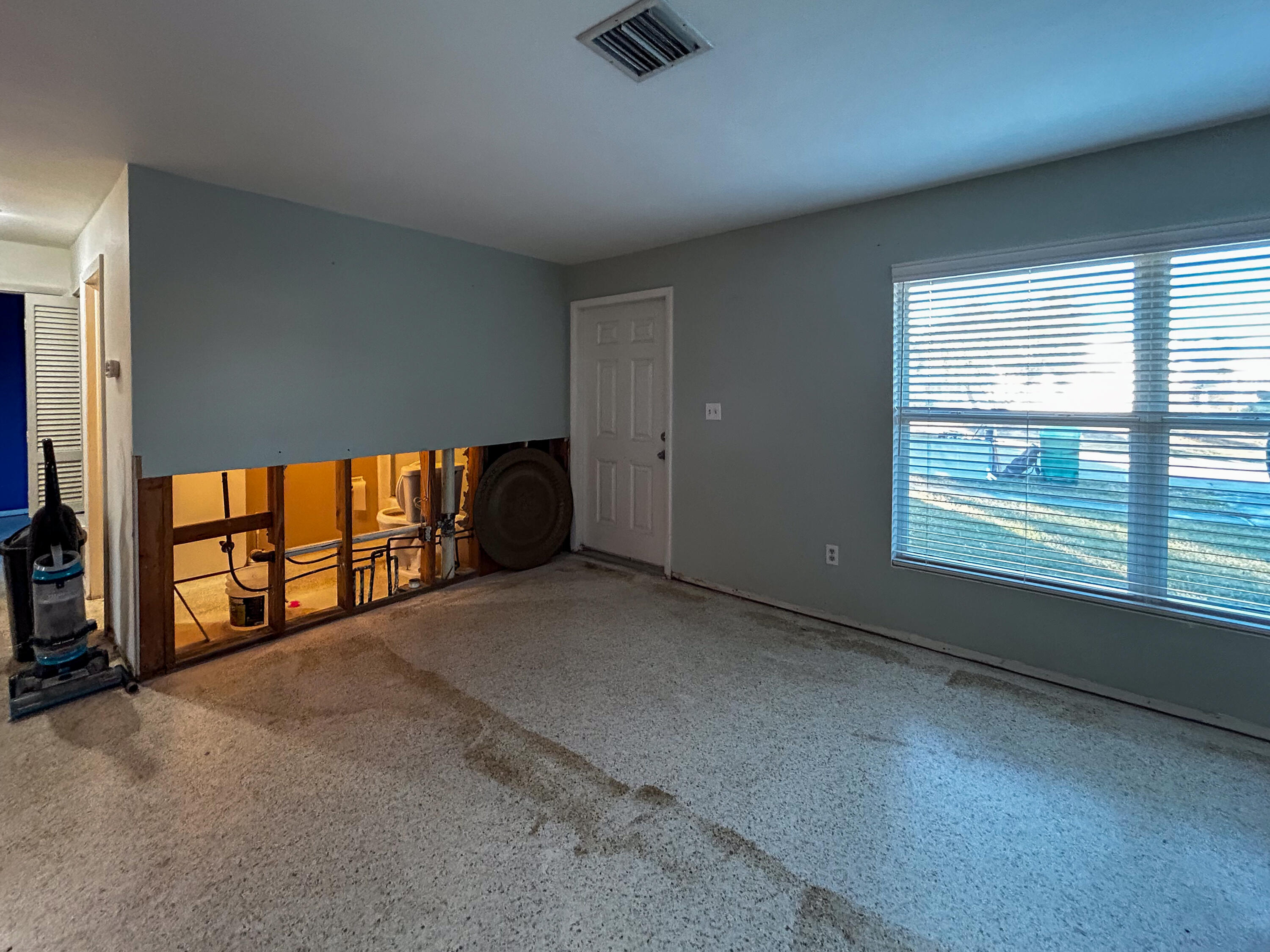 868 Lance Street Sebastian, FL 32958 - Photo 6 of 37 a view of an empty room with a window